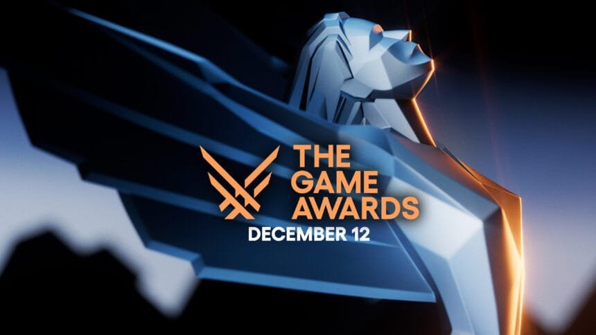 A promotional graphic for The Game Awards. The event is scheduled to take place on December 12. The graphic features a stylized, angular statue or trophy, resembling a winged figure. The colors used are metallic blue and orange, creating a striking contrast. The text "THE GAME AWARDS" is prominently displayed in orange, along with the date "DECEMBER 12" below it. The design is sleek and modern, appealing to a gaming audience and highlighting the significance of the event in the gaming industry.